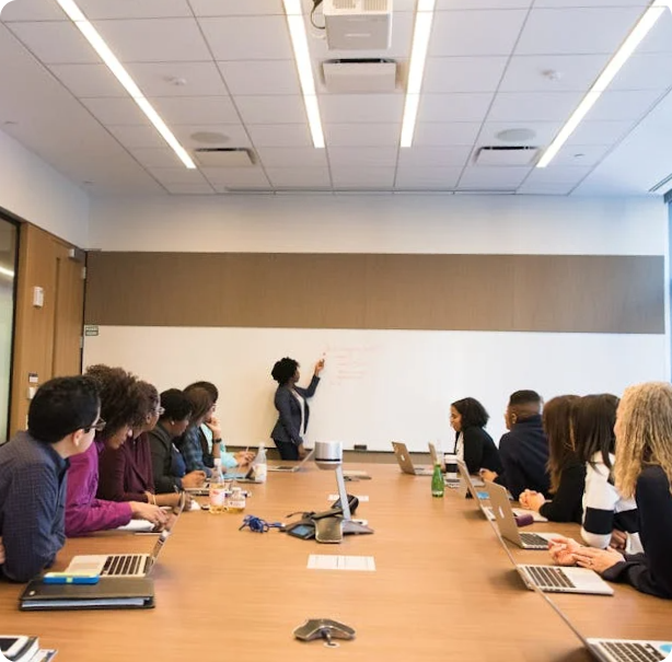 Collaborative work meeting in a conference room.
